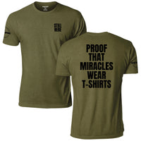 Still Here: Proof That Miracles Wear T-Shirts Tee, military olive, front and back